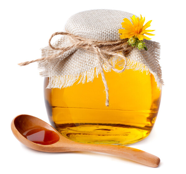 一罐蜂蜜和木勺图片