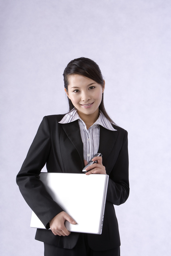 拿著筆記本的職業(yè)女性圖片圖片