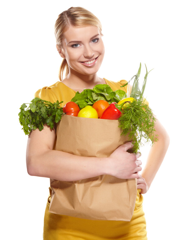 抱着蔬菜水果袋子的美女图片