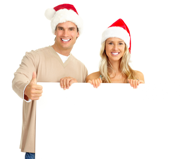 带圣诞帽手拿空白广告牌的美女帅哥图片