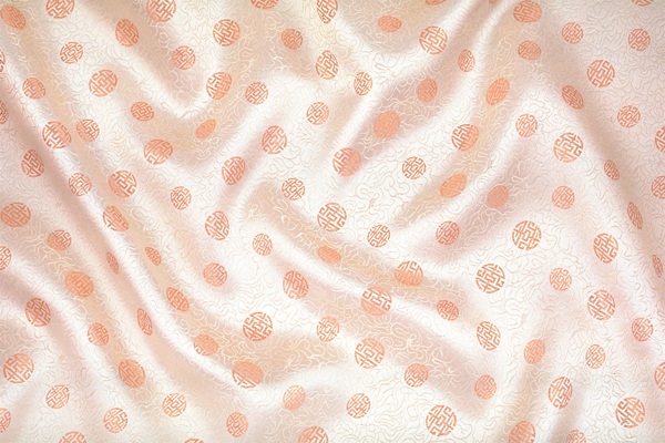 橙色波点褶皱布料背景素材填充背景