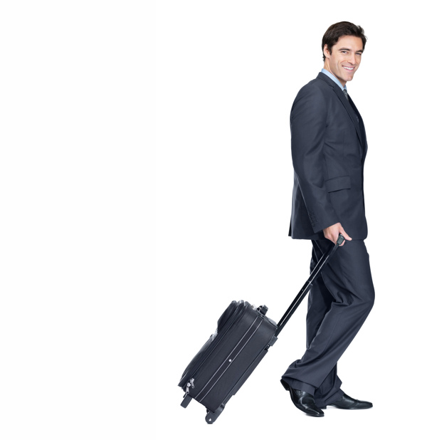 拖着行李箱的商务男性图片